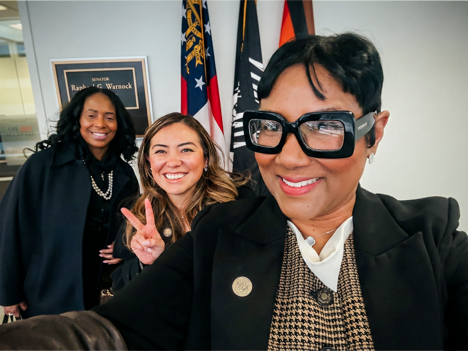 A friendly selfie of Lorraine Cochran-Johnson with community members.